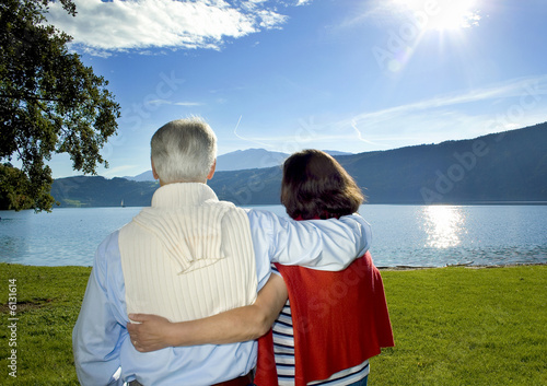 attractive married mature couple enjoying the sunset.