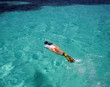 Female Snorkeler Swimming to Reefs in the Caribbean Female Snorkeler Swimming to Reefs in the Caribbean