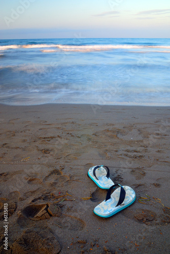 sandals on beach with long exposure