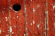 Door with a peep hole painted in red Door with a peep hole painted in red