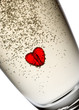 Photo: Heart in champagne flute. Isolated on white. Heart in champagne flute. Isolated on white.