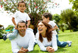 happy family smiling in a portrait of a mum and dad