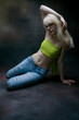 blond girl dancing, studio shot