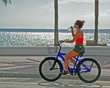 Girl on Bike Drinking Water -2
