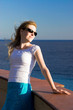 Young woman relaxing on sea coast.