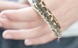 child holding a boa snake