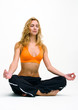 Young blonde woman making yoga- exercises..