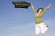 woman jumping in the sky, happy because spring is coming