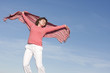 woman jumping in the sky, happy because spring is coming