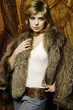 Beautiful blonde woman wearing fur coat