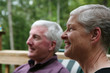 Happy Senior Couple smiling outside