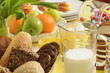 an easter table setting with fresh products and tulips