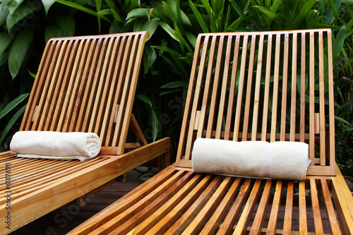 Lounge chairs surround a pool at a five star resort