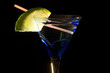 Cocktails, drinks, and alcohol in a colored glass at a bar