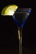 Cocktails, drinks, and alcohol in a colored glass at a bar