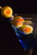 Cocktails, drinks, and alcohol in a colored glass at a bar