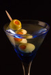 Cocktails, drinks, and alcohol in a colored glass at a bar