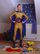 Superhero in messy bedroom