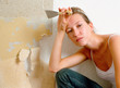 Tired woman holding scraper