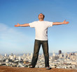 A man standing on a hill with a view of San Francisco