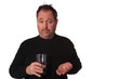 Man taking two pills on a White Background. 