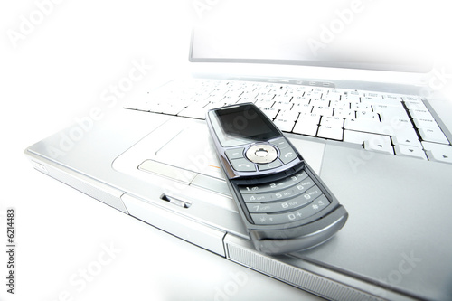 Solarized laptop and a modern slip-top cellphone