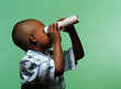 Boy using a toilet roll tube as a telescope