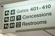 Direction signs in an airport terminal for travelers Direction signs in an airport terminal for travelers