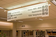Direction signs in an airport terminal for travelers Direction signs in an airport terminal for travelers