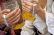 Couple drinking steins of lager