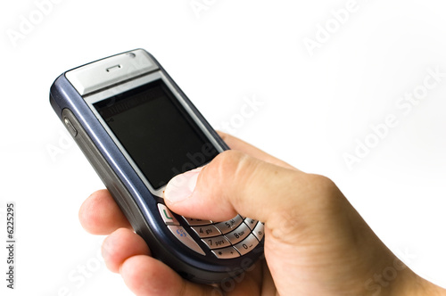 Photo: A hand hold a handset A hand hold a handset