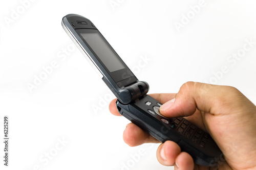 Photo: A hand hold a handset A hand hold a handset