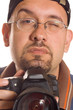 Young man with digital camera taking picture Young man with digital camera taking picture