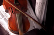 Old violin with composition of music notes