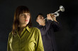 Trumpet man standing behind the woman. 