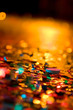 Shining confetti by projectors of different colors on a holiday