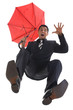Young, screaming businessman with umbrella