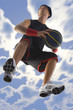 Young basketball player with ball in action