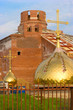 Construction of new brick church with golden cupola