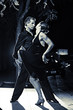 Couple dancing hot latin dance on a street at night Couple dancing hot latin dance on a street at night