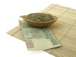 Dry mate and thai money on bamboo-mat. Dry mate and thai money on bamboo-mat.