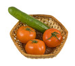 An isolated crib (basket) with tomatoes and cucumber An isolated crib (basket) with tomatoes and cucumber