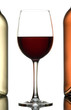 Foto: Glass of wine between two bottles of wine isolated on white. Glass of wine between two bottles of wine isolated on white.