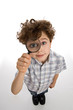 Boy holding magnifying glass Boy holding magnifying glass
