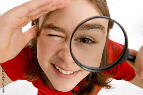 Girl holding magnifying glass