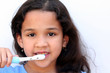 Young girl is brushing her teeth in bathroom Young girl is brushing her teeth in bathroom