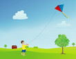 boy flying a kite in an open field
