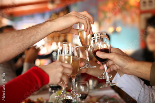 Photo: Celebration. Glasses of champagne and wine in hands. Celebration. Glasses of champagne and wine in hands.