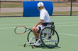 A wheelchair bound athlete on the tennis court
