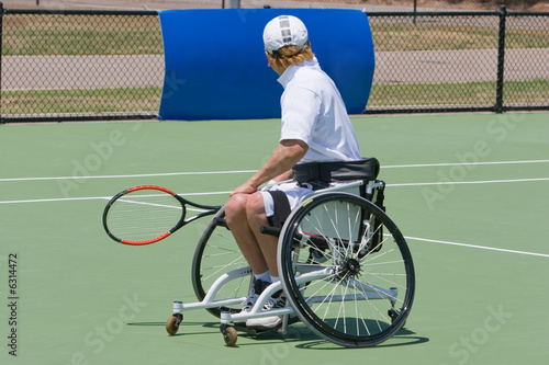 Photo: A wheelchair bound athlete on the tennis court A wheelchair bound athlete on the tennis court
